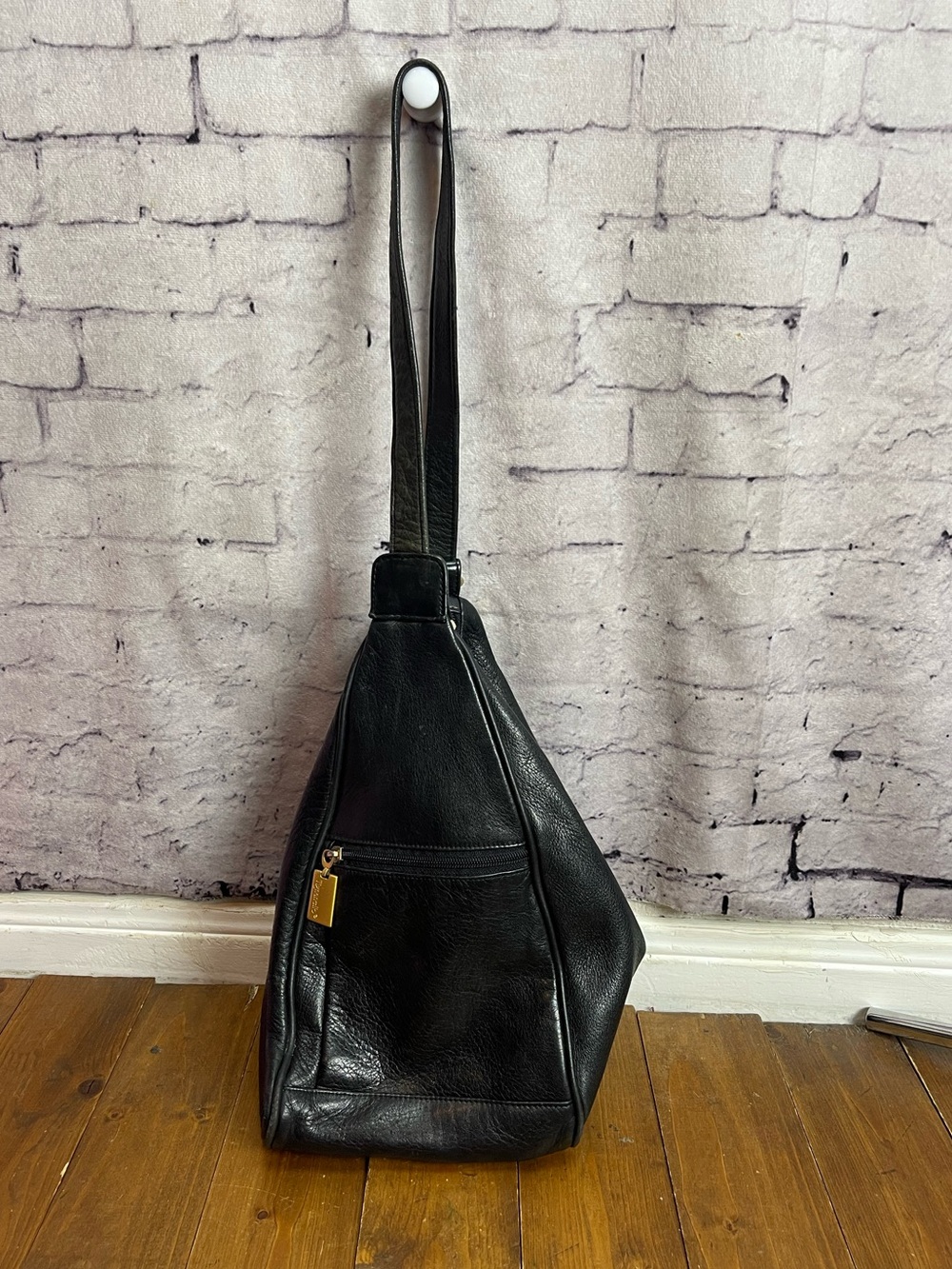 Tignanello black leather sling style purse